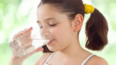 Children drinking safe tap water tested by a water quality laboratory
